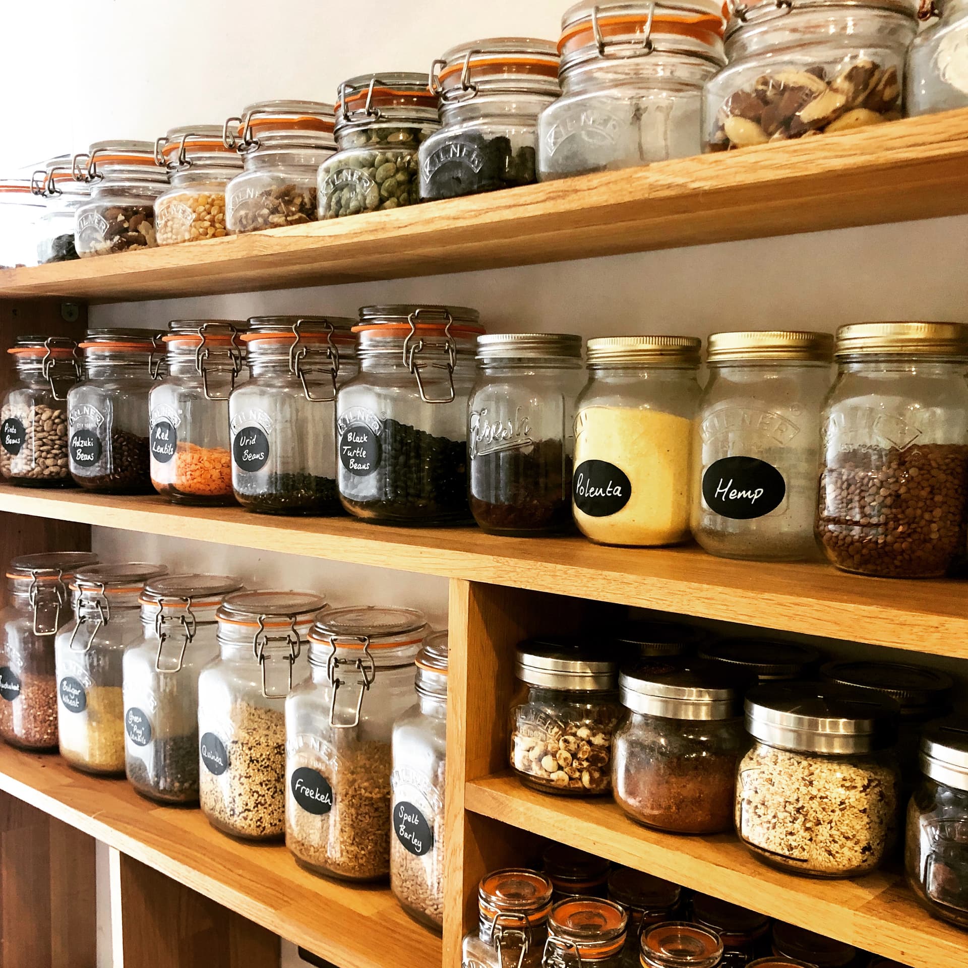 Organized healthy nutrition pantry with glass jars